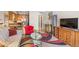 Open-concept living space featuring modern furnishings, an area rug, and natural light at 9320 E Center Ave # 4B, Denver, CO 80247
