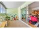 Bright sunroom with large sliding doors that open to the living area at 9320 E Center Ave # 4B, Denver, CO 80247