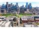 Stunning aerial view of downtown area with modern high-rise buildings and lush green spaces at 1521 Central St # 2D, Denver, CO 80211
