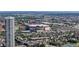 Expansive aerial view of a cityscape featuring a modern arena, high-rise buildings and a vibrant atmosphere at 1521 Central St # 2D, Denver, CO 80211