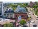 Scenic aerial view of a neighborhood with modern buildings, street activity, and rooftop dining at 1521 Central St # 2D, Denver, CO 80211