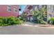 Modern condo building with private balconies and lush landscaping, creating a welcoming ambiance at 1521 Central St # 2D, Denver, CO 80211