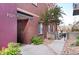 Brick condominium exterior, #1521, with xeriscaped garden and pathway at 1521 Central St # 2D, Denver, CO 80211