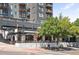 Modern building with a restaurant on the ground floor featuring an outdoor dining area at 1521 Central St # 2D, Denver, CO 80211