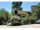 Charming neighborhood establishment with vibrant greenery, 'Forest Room 5' sign, and unique character at 1521 Central St # 2D, Denver, CO 80211