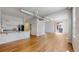 Expansive living area with hardwood floors and a modern kitchen, perfect for entertaining or relaxing at 1521 Central St # 2D, Denver, CO 80211