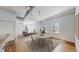 Inviting living area featuring hardwood floors, high ceilings, and contemporary finishes offering comfort and style at 1521 Central St # 2D, Denver, CO 80211