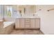 Bathroom boasting dual sinks, modern fixtures, and large mirrors at 10201 Rifle St, Commerce City, CO 80022