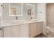 Bathroom vanity boasting dual sinks, modern fixtures, and large mirrors at 10201 Rifle St, Commerce City, CO 80022