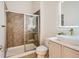 Modern bathroom featuring a glass-enclosed shower, vanity with vessel sink and unique decorative mirror at 10201 Rifle St, Commerce City, CO 80022