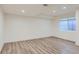 This room features a window, modern flooring, and recessed lighting at 10201 Rifle St, Commerce City, CO 80022