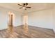 Spacious bedroom featuring luxury vinyl flooring and a ceiling fan at 10201 Rifle St, Commerce City, CO 80022