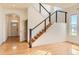 Bright entryway with hardwood floors, modern staircase, and lots of natural light at 10201 Rifle St, Commerce City, CO 80022