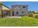 Exterior elevation with a large backyard and gazebo at 10201 Rifle St, Commerce City, CO 80022
