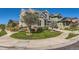 Charming two-story home with a well-maintained lawn and beautiful landscaping at 10201 Rifle St, Commerce City, CO 80022