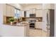Bright kitchen featuring stainless steel appliances, granite countertops, and ample cabinet space at 10201 Rifle St, Commerce City, CO 80022