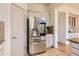 Stainless steel refrigerator and views of kitchen layout with granite countertops and tiled flooring at 10201 Rifle St, Commerce City, CO 80022