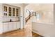 Open living space featuring staircase, built-in shelving and views of kitchen at 10201 Rifle St, Commerce City, CO 80022