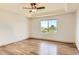 Spacious main bedroom with tray ceilings and a large window providing abundant natural light at 10201 Rifle St, Commerce City, CO 80022