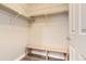 Walk-in closet with a bench, perfect for organizing your wardrobe at 10201 Rifle St, Commerce City, CO 80022
