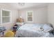 Cozy bedroom with wood floors and lots of natural light at 1712 S Gilpin St, Denver, CO 80210