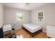 Well-lit bedroom featuring hardwood floors, neutral walls, and ample natural light at 1712 S Gilpin St, Denver, CO 80210