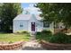 Charming single-Gathering home with well-maintained lawn and inviting brick-lined walkway at 1712 S Gilpin St, Denver, CO 80210