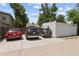 Three cars parked in front of the two car garage at 1712 S Gilpin St, Denver, CO 80210
