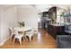 Inviting living and dining area with hardwood floors and an archway leading to the kitchen at 1712 S Gilpin St, Denver, CO 80210