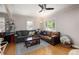 Bright and airy living room with hardwood floors, comfortable sofas, and natural light at 1712 S Gilpin St, Denver, CO 80210