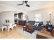 Open-concept living room with hardwood floors, stylish furniture, and an inviting atmosphere at 1712 S Gilpin St, Denver, CO 80210