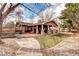 Inviting backyard with a brick patio and walkway is ideal for enjoying outdoor gatherings and relaxation at 3820 S Ames St, Denver, CO 80235