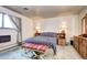 Cozy bedroom features a comfortable bed and classic furnishings at 3820 S Ames St, Denver, CO 80235