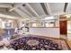 Open-concept dining and living area with hardwood floors and natural light at 3820 S Ames St, Denver, CO 80235