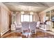 Bright dining room features hardwood floors, modern lighting, and stylish furniture at 3820 S Ames St, Denver, CO 80235