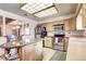 Bright kitchen featuring stainless steel appliances and granite countertops at 3820 S Ames St, Denver, CO 80235