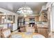 Open concept kitchen with stainless steel appliances and island with breakfast bar at 3820 S Ames St, Denver, CO 80235
