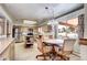 Kitchen with stainless steel appliances, island with dining area, and plenty of counter space at 3820 S Ames St, Denver, CO 80235