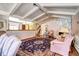 Open living space featuring a stone fireplace and access to other living areas at 3820 S Ames St, Denver, CO 80235