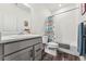 Bright bathroom with modern vanity, shower, and neutral finishes at 15376 Ivanhoe Ct, Thornton, CO 80602