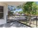 This balcony shows the peaceful surrounding community and is complete with a black metal railing at 2375 S Linden Ct # 201, Denver, CO 80222