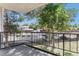 This balcony shows the peaceful surrounding community and is complete with a black metal railing at 2375 S Linden Ct # 201, Denver, CO 80222