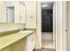 Bathroom featuring a sink and vanity, and shower-tub combo at 2375 S Linden Ct # 201, Denver, CO 80222