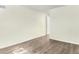 Bedroom with hardwood flooring and fresh neutral paint at 2375 S Linden Ct # 201, Denver, CO 80222