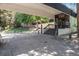 Exterior building entrance with covered drive through and mature landscaping at 2375 S Linden Ct # 201, Denver, CO 80222