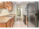Kitchen with stainless steel sink and standard appliances at 2375 S Linden Ct # 201, Denver, CO 80222