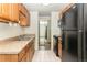 Functional kitchen featuring stainless steel appliances and efficient layout at 2375 S Linden Ct # 201, Denver, CO 80222