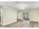 Inviting living room features wood flooring and a sliding glass door to the outside at 2375 S Linden Ct # 201, Denver, CO 80222
