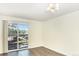 Bright living room with wood flooring and sliding glass doors opening to an outdoor space at 2375 S Linden Ct # 201, Denver, CO 80222