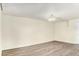 Comfortable living room featuring wood-look floors and a neutral color palette at 2375 S Linden Ct # 201, Denver, CO 80222